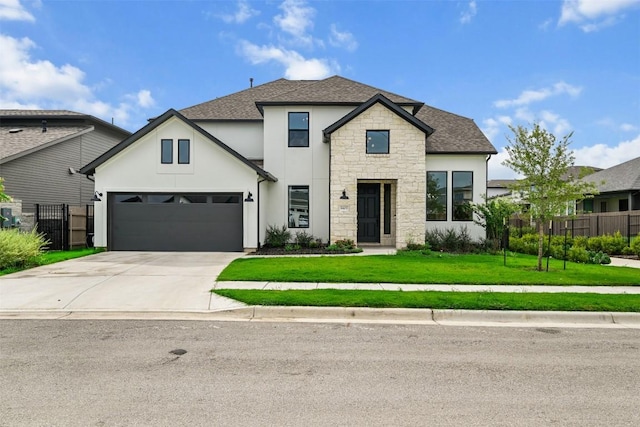 8405 Ambergill Ct, Austin, TX 78744 - view of front of home featuring stone siding, stucco siding, driveway, and roof with shingles