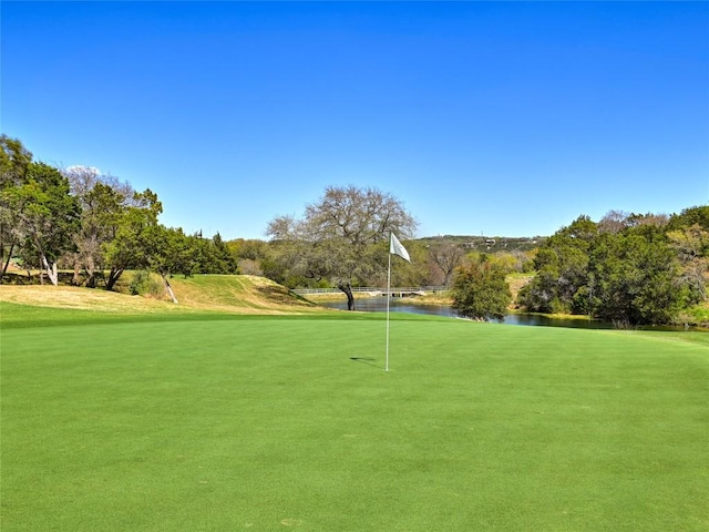 8212 Barton Club Dr Unit 9-10, Austin, TX 78735 - view of community featuring a water view, an area to practice putting, view of golf course, and view of wooded area