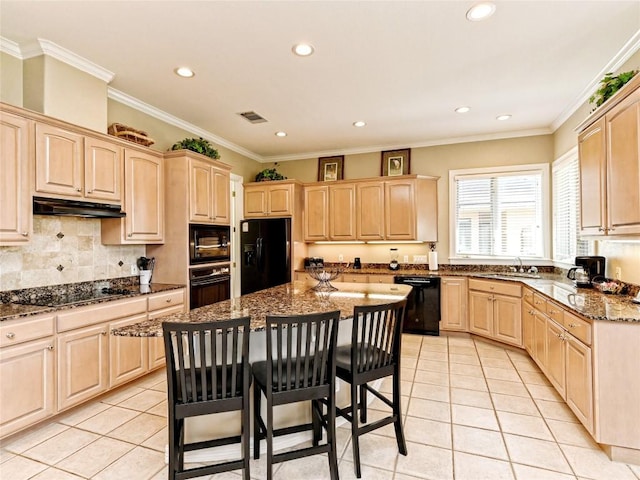 8212 Barton Club Dr Unit 9-10, Austin, TX 78735 - kitchen with black appliances, light brown cabinetry, under cabinet range hood, light tile patterned flooring, and recessed lighting