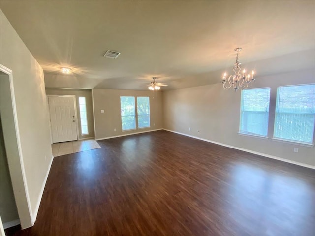 358 Spring, Kyle, TX 78640 - unfurnished living room featuring wood finished floors, a chandelier, and a ceiling fan