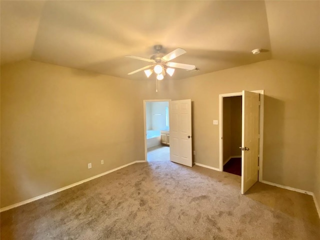 358 Spring, Kyle, TX 78640 - unfurnished bedroom with vaulted ceiling, carpet flooring, and a ceiling fan