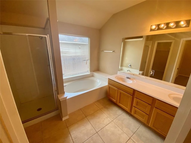 358 Spring, Kyle, TX 78640 - full bath with a stall shower, a garden tub, double vanity, lofted ceiling, and tile patterned flooring