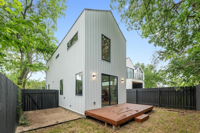 4428 Jinx Ave Unit 2, Austin, TX 78745 - back of house featuring a fenced backyard, a deck, board and batten siding, and a balcony