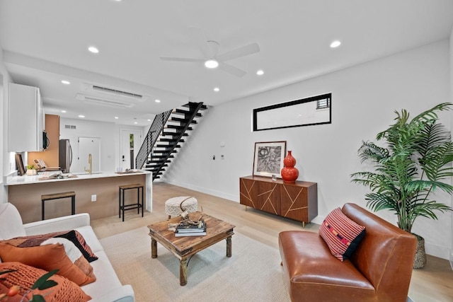 4428 Jinx Ave Unit 2, Austin, TX 78745 - living room featuring stairway, recessed lighting, a ceiling fan, and light wood-type flooring