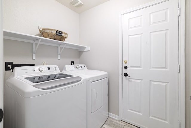 203 Endeavour, Kyle, TX 78640 - laundry area with independent washer and dryer and light wood-style flooring