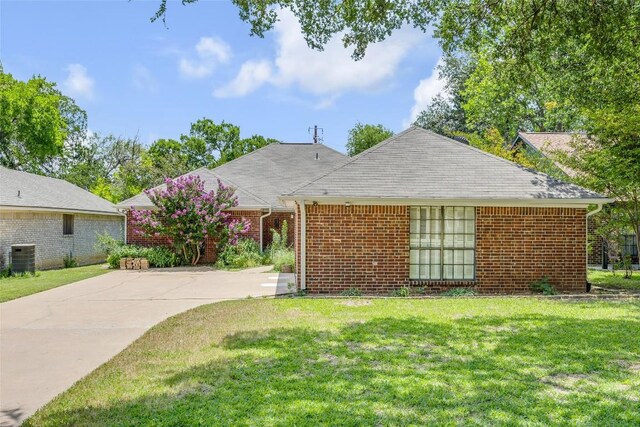 10007 Brantley Bnd, Austin, TX 78748 - ranch-style house with a front lawn and brick siding