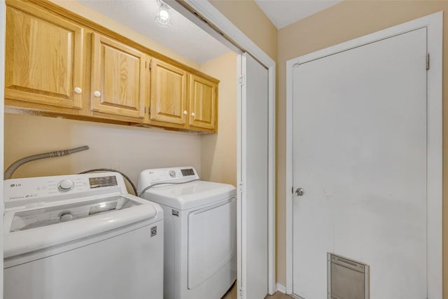 10007 Brantley Bnd, Austin, TX 78748 - laundry area featuring cabinet space and independent washer and dryer