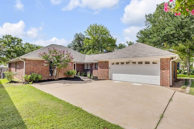 10007 Brantley Bnd, Austin, TX 78748 - single story home with an attached garage, brick siding, driveway, and a front lawn