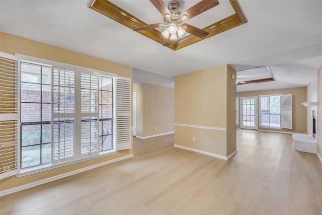 10007 Brantley Bnd, Austin, TX 78748 - unfurnished living room with wood finished floors, a ceiling fan, and a raised ceiling