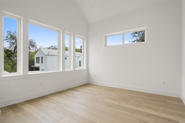 900 S 2nd St Unit 18, Austin, TX 78704 - spare room featuring light wood-style floors and lofted ceiling