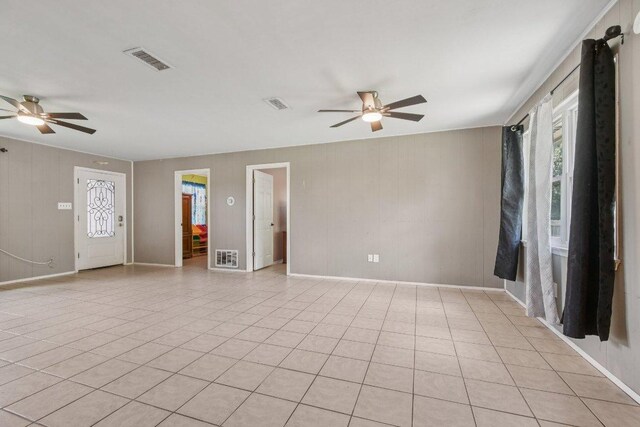 709 Harvey Ave, Burnet, TX 78611 - spare room featuring ceiling fan and light tile patterned floors