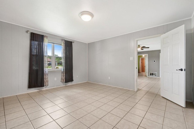 709 Harvey Ave, Burnet, TX 78611 - unfurnished room featuring ornamental molding, light tile patterned flooring, and a ceiling fan