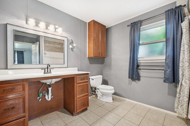 709 Harvey Ave, Burnet, TX 78611 - bathroom featuring vanity, tile patterned floors, and crown molding