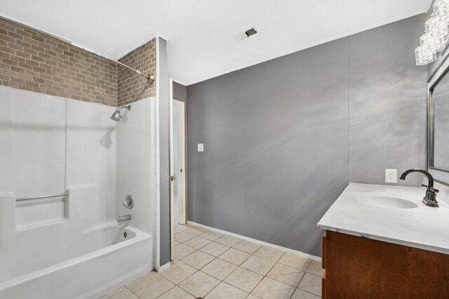 709 Harvey Ave, Burnet, TX 78611 - full bath with vanity, shower / tub combination, and tile patterned floors