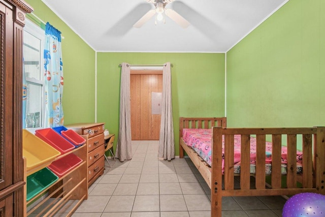709 Harvey Ave, Burnet, TX 78611 - bedroom with ornamental molding, light tile patterned floors, multiple windows, and a ceiling fan