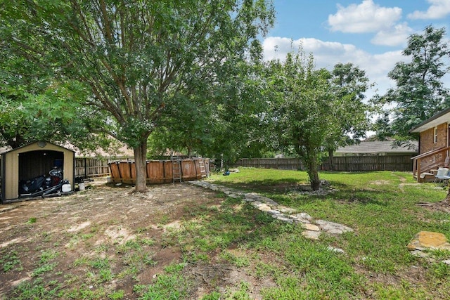 709 Harvey Ave, Burnet, TX 78611 - fenced backyard featuring a shed and a hot tub