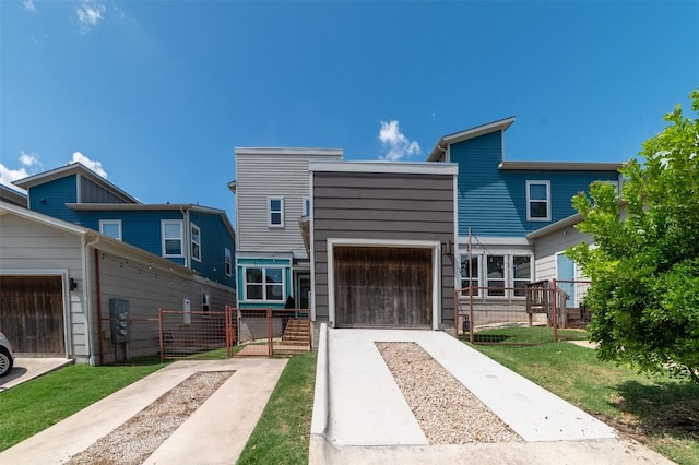 1904 Cleese Dr Unit 172, Austin, TX 78741 - view of front of house featuring driveway, a gate, and a garage