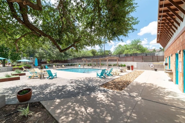 1904 Cleese Dr Unit 172, Austin, TX 78741 - community pool featuring a patio area and a fenced backyard