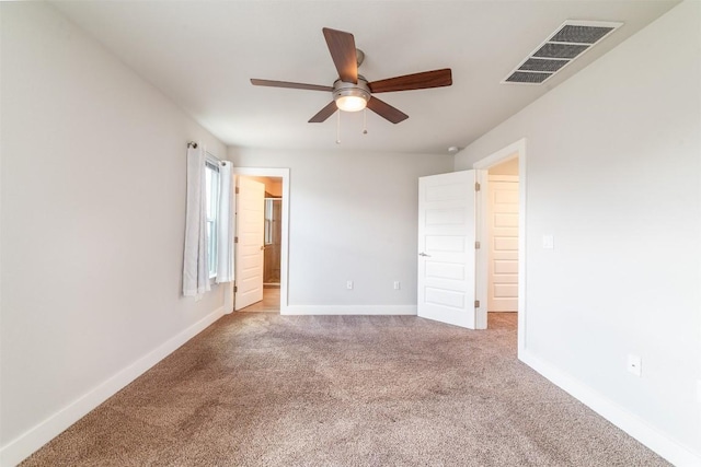 1904 Cleese Dr Unit 172, Austin, TX 78741 - unfurnished bedroom featuring carpet floors, ceiling fan, and connected bathroom