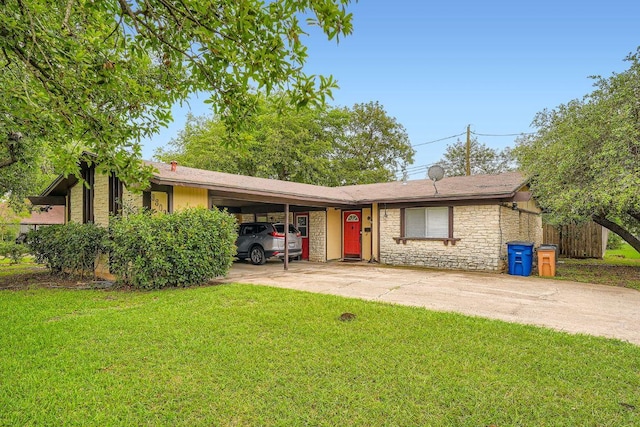 3309 Whitepine Dr, Austin, TX 78757 - ranch-style home featuring a front yard, stone siding, concrete driveway, and a carport