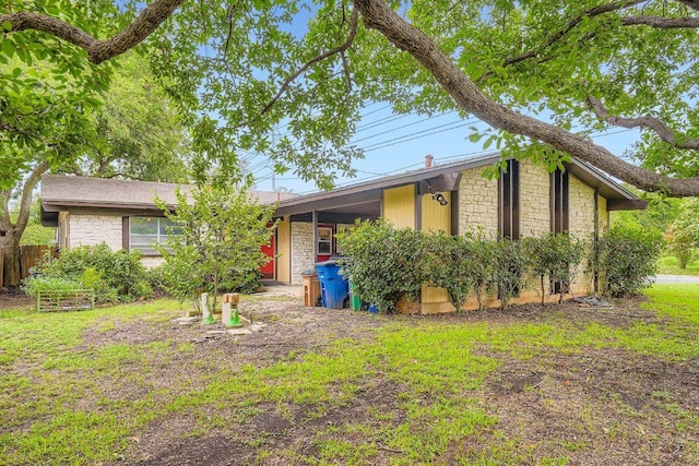 3309 Whitepine Dr, Austin, TX 78757 - view of front of home with an attached carport and stone siding