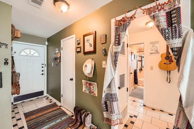 3309 Whitepine Dr, Austin, TX 78757 - entryway featuring light tile patterned flooring and baseboards