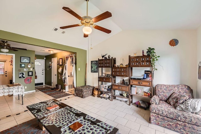 3309 Whitepine Dr, Austin, TX 78757 - living area featuring a ceiling fan, tile patterned floors, and vaulted ceiling