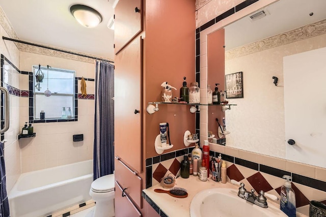 3309 Whitepine Dr, Austin, TX 78757 - full bath featuring tile walls, shower / bathtub combination with curtain, vanity, and tasteful backsplash