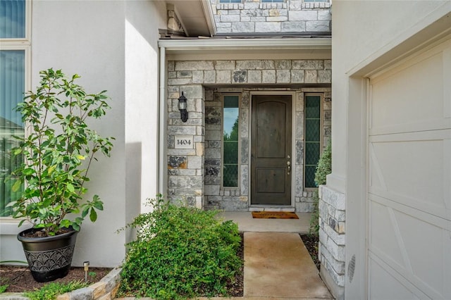 1404 Scenic Oaks Dr, Georgetown, TX 78628 - doorway to property with stone siding and stucco siding