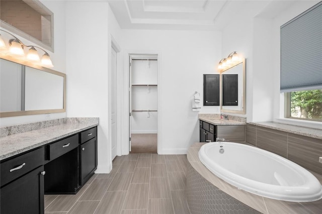 1404 Scenic Oaks Dr, Georgetown, TX 78628 - full bath featuring vanity, a bath, and a spacious closet