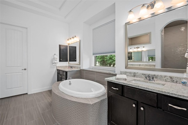 1404 Scenic Oaks Dr, Georgetown, TX 78628 - bathroom with two vanities and a garden tub