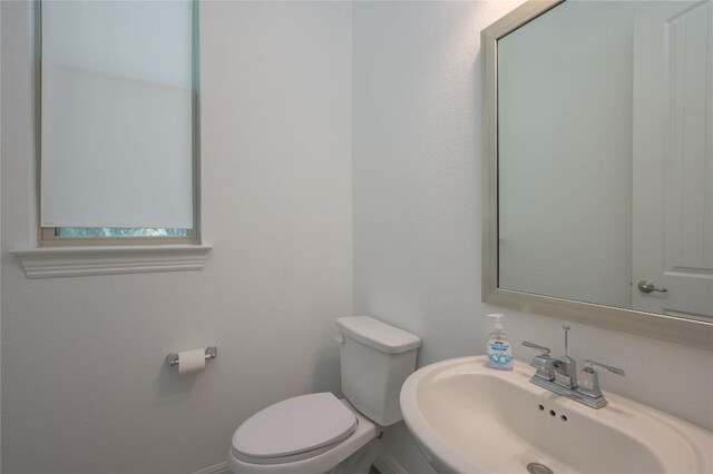 1404 Scenic Oaks Dr, Georgetown, TX 78628 - half bathroom with a sink and toilet