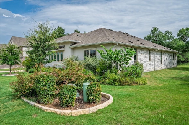 1404 Scenic Oaks Dr, Georgetown, TX 78628 - view of property exterior featuring a lawn, stucco siding, a shingled roof, and stone siding
