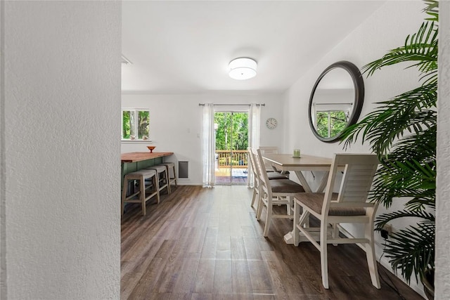 7801 Elderberry Dr, Austin, TX 78745 - dining room featuring wood finished floors and a textured wall