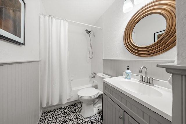 7801 Elderberry Dr, Austin, TX 78745 - full bath featuring a wainscoted wall, shower / bath combination with curtain, vanity, and tile patterned flooring