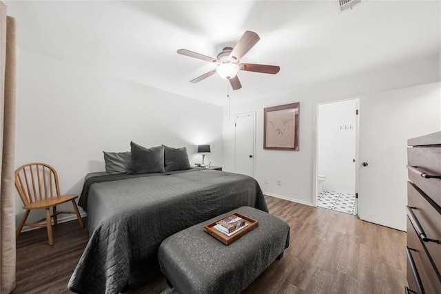 7801 Elderberry Dr, Austin, TX 78745 - bedroom with wood finished floors, ceiling fan, and ensuite bath