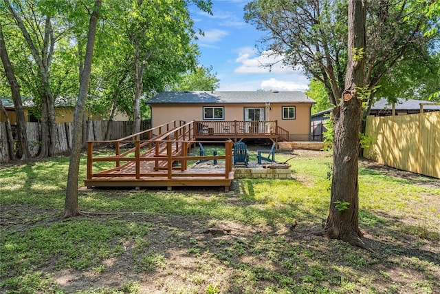7801 Elderberry Dr, Austin, TX 78745 - rear view of property featuring a fenced backyard, a wooden deck, and stairs