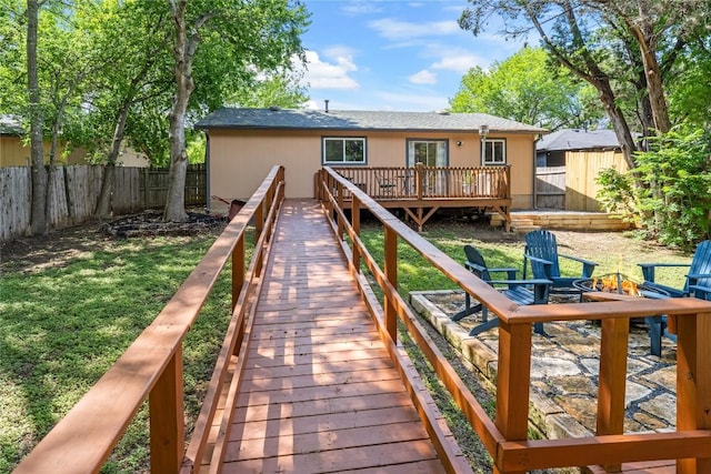 7801 Elderberry Dr, Austin, TX 78745 - rear view of property with a fenced backyard, a deck, and stucco siding