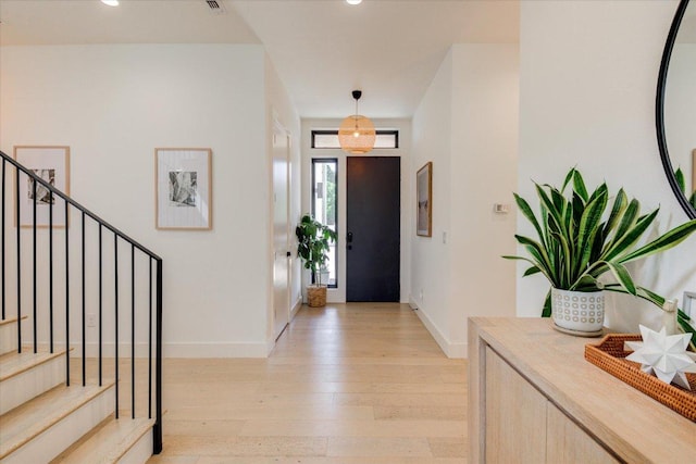 8009 Golden Oaks Ln, Austin, TX 78737 - entryway with light wood finished floors, stairs, and recessed lighting