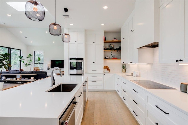 8009 Golden Oaks Ln, Austin, TX 78737 - kitchen with appliances with stainless steel finishes, decorative backsplash, light wood-style floors, open shelves, and recessed lighting