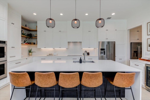 8009 Golden Oaks Ln, Austin, TX 78737 - kitchen featuring appliances with stainless steel finishes, open shelves, light countertops, white cabinets, and recessed lighting