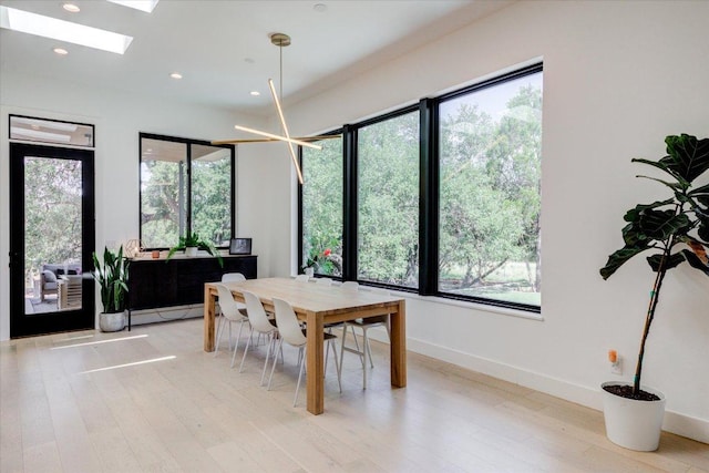 8009 Golden Oaks Ln, Austin, TX 78737 - dining room featuring a skylight, recessed lighting, and light wood-type flooring