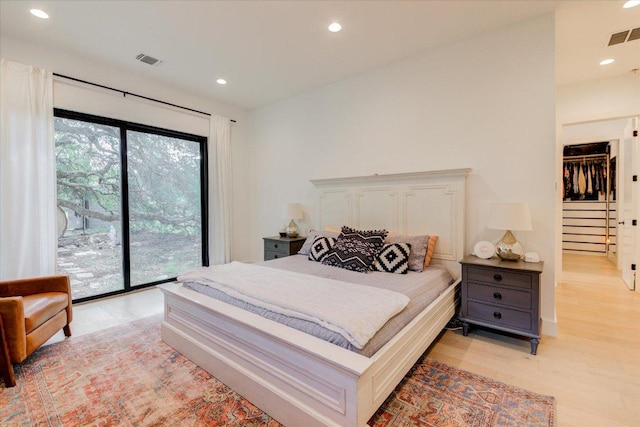 8009 Golden Oaks Ln, Austin, TX 78737 - bedroom with access to exterior, light wood-type flooring, and recessed lighting