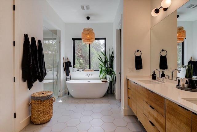 8009 Golden Oaks Ln, Austin, TX 78737 - full bathroom with double vanity, a freestanding bath, and tile patterned floors