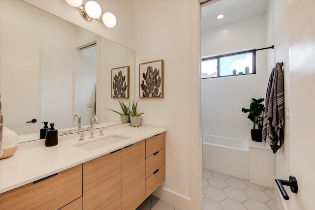 8009 Golden Oaks Ln, Austin, TX 78737 - bathroom featuring vanity, tile patterned flooring, washtub / shower combination, and recessed lighting