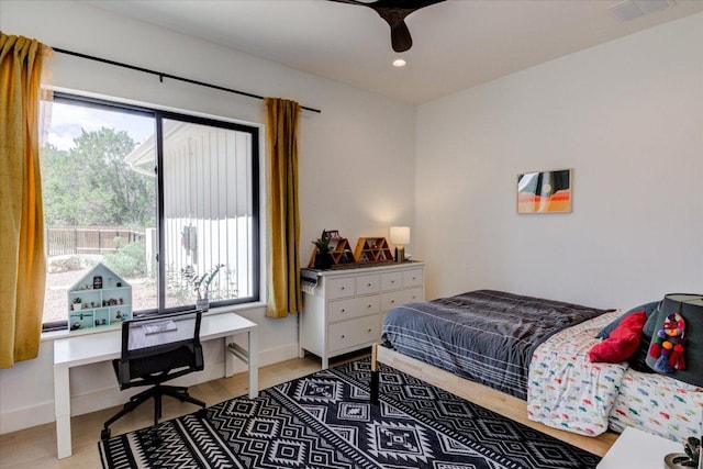8009 Golden Oaks Ln, Austin, TX 78737 - bedroom with light wood-style flooring, recessed lighting, and an office area