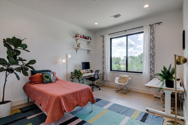 8009 Golden Oaks Ln, Austin, TX 78737 - bedroom featuring wood finished floors, recessed lighting, and an office area