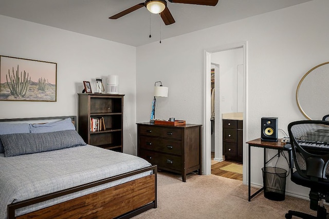 175 Amber Gln, Maxwell, TX 78656 - bedroom featuring light carpet, ensuite bathroom, and ceiling fan