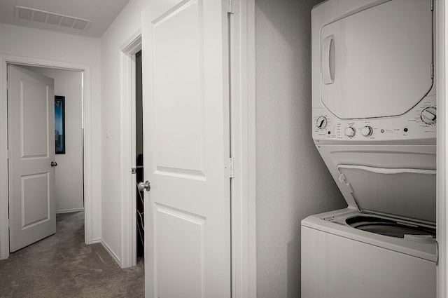 175 Amber Gln, Maxwell, TX 78656 - laundry room with stacked washer / dryer and carpet flooring