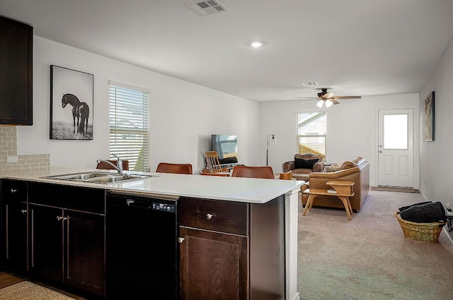175 Amber Gln, Maxwell, TX 78656 - kitchen featuring dishwasher, a peninsula, light countertops, and a ceiling fan